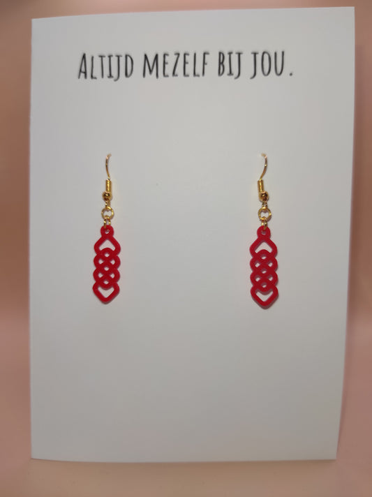 Wenskaart met rode oorbellen. Giftcards with red earrings.