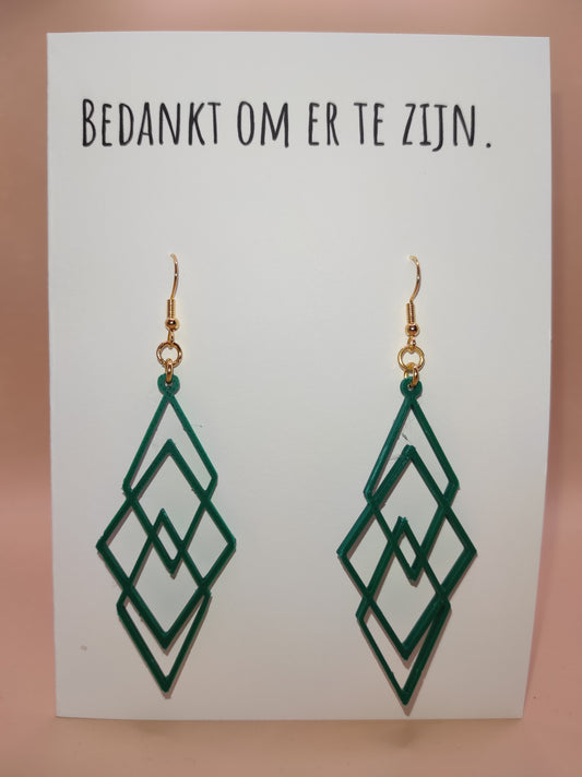 Wenskaart met groene oorbellen. Giftcard with green earrings.